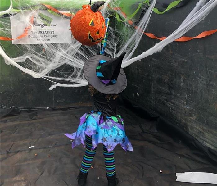 A child swings at the piñata