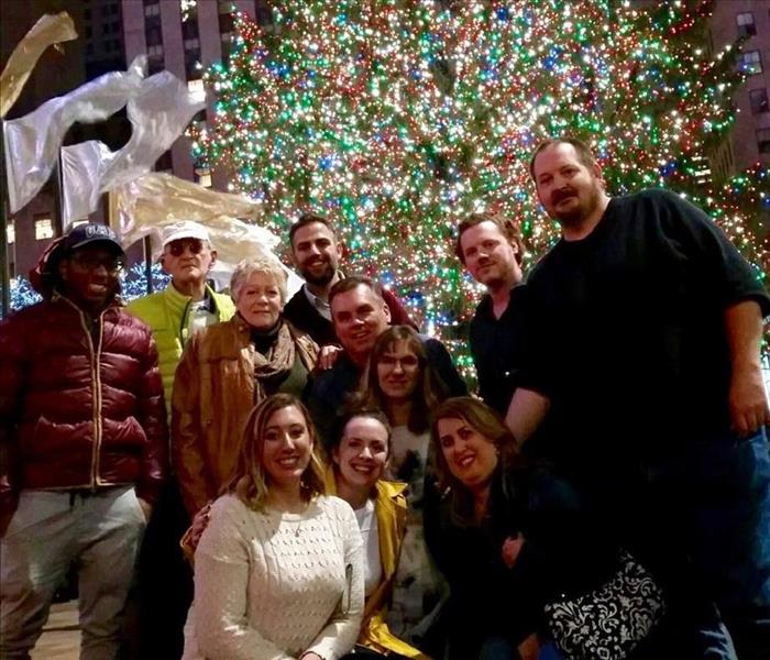 The staff of SERVPRO of Edison in front of the Rockefeller Christmas tree