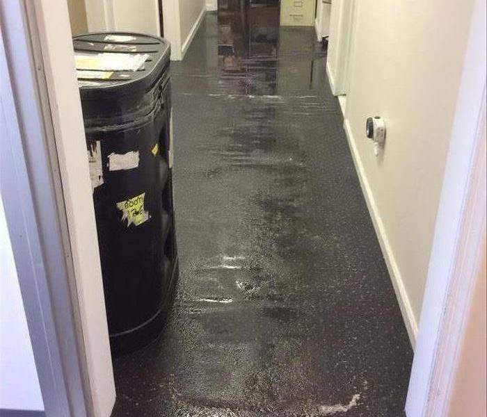 This hallway was flooded as a result of local storms